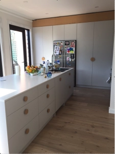 Wooden vintage style handles in new kitchen